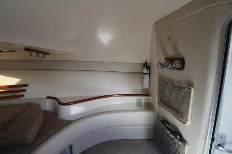Slide: The Image of 2001 Grady-White Express 330 cabin interior with seating and storage. - 30