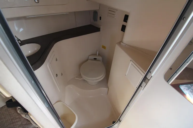 Slide: The Image of 2001 Grady-White Express 330 boat bathroom with toilet and sink. - 37
