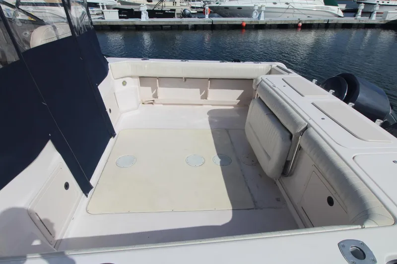 Slide: The Image of 2001 Grady-White Express 330 boat deck with seating, docked at marina. - 7