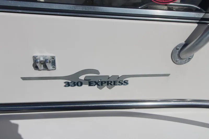 Slide: The Image of Grady-White Express 330 boat logo on white surface, 2001 model. - 8