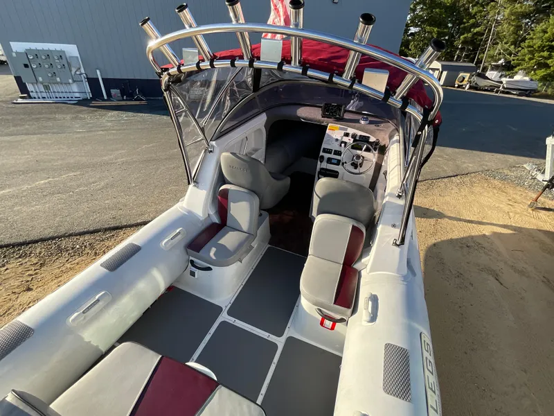 Slide: The Image of 2013 Sealegs 7.7m Cabin boat interior with seating and control panel. - 12