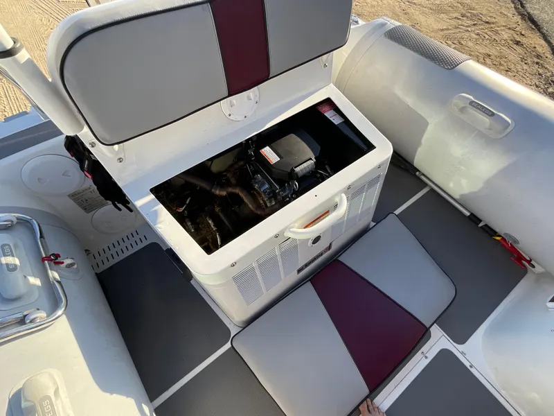 Slide: The Image of Sealegs 7.7m Cabin 2013 interior showing engine compartment and seating area. - 13