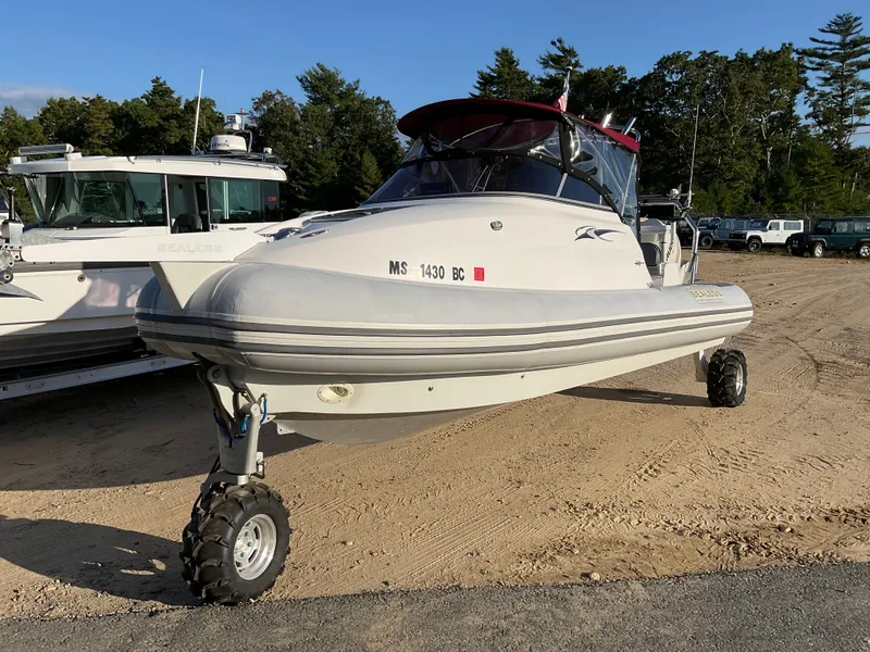 Slide: The Image of 2013 Sealegs 7.7m Cabin amphibious boat on land with wheels extended. - 2
