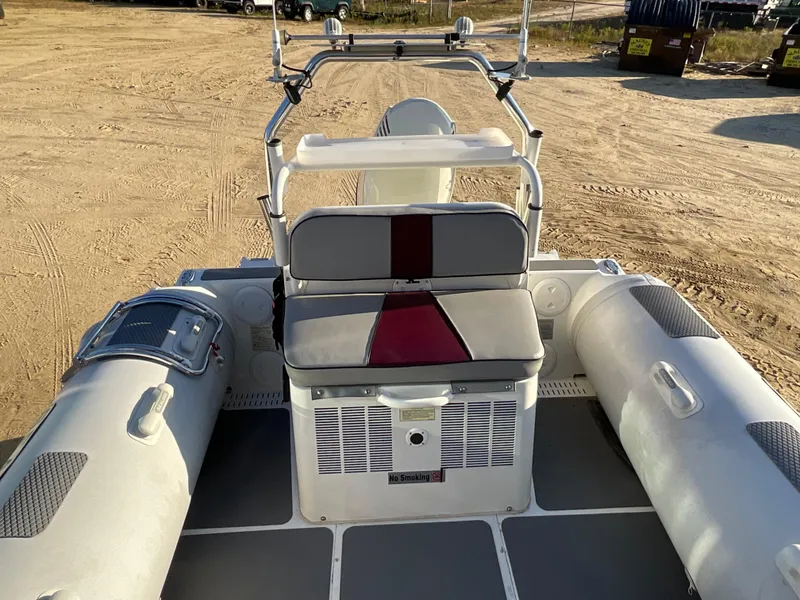 Slide: The Image of 2013 Sealegs 7.7m Cabin boat interior with seating and control panel. - 7