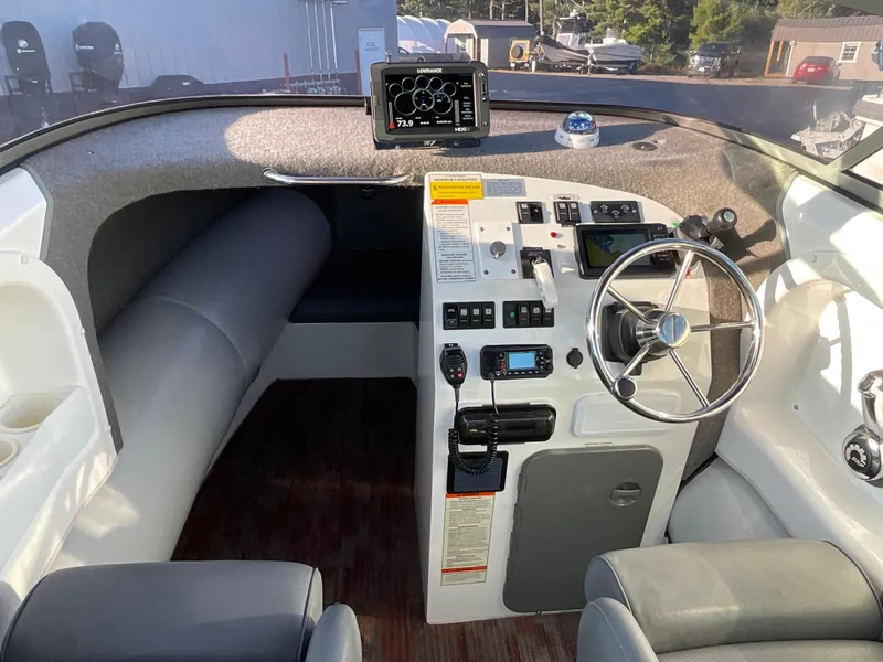 Slide: The Image of Sealegs 7.7m Cabin 2013 boat interior with steering wheel and control panel. - 8