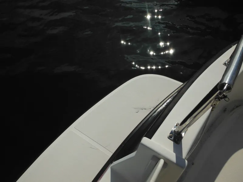 Slide: The Image of Nordic Tug 32 boat deck, 2005 model, with sunlight reflecting on water. - 10