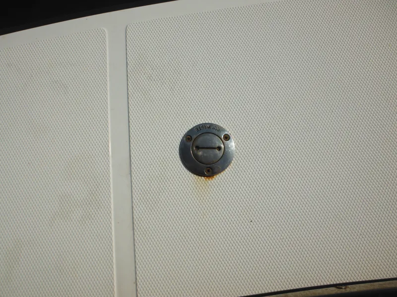 Slide: The Image of Close-up of a 2005 Nordic Tug 32 deck detail with a metal fitting. - 12