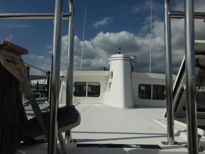 Slide: The Image of 2005 Nordic Tug 32 boat deck with clear sky and clouds. - 19