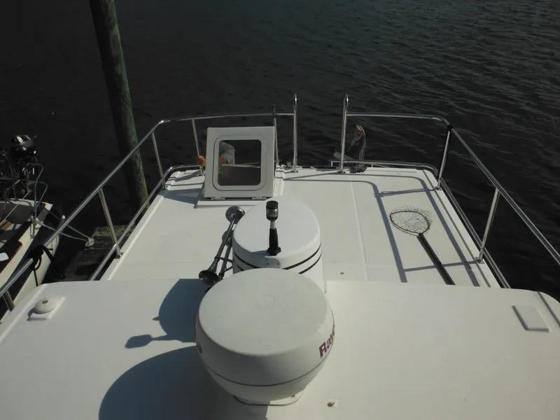 Slide: The Image of Top deck of 2005 Nordic Tug 32, featuring radar equipment and safety railings. - 23