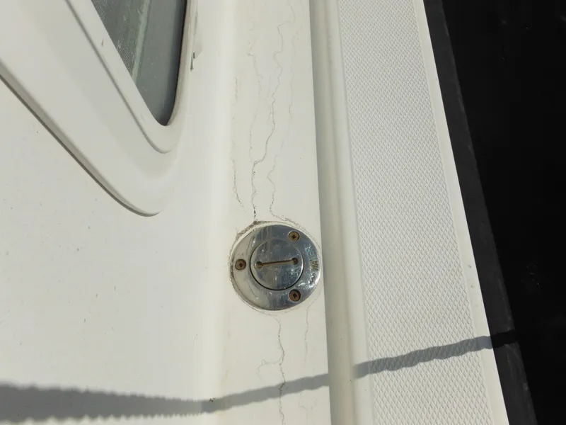 Slide: The Image of Close-up of a 2005 Nordic Tug 32 deck detail with metal fitting. - 28