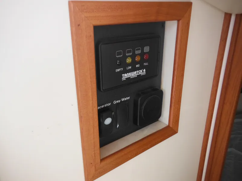 Slide: The Image of Control panel on 2005 Nordic Tug 32 boat, featuring tank level indicators. - 33