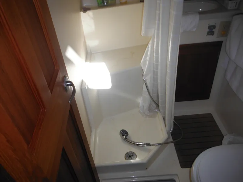 Slide: The Image of 2005 Nordic Tug 32 bathroom with shower and wooden door. - 36