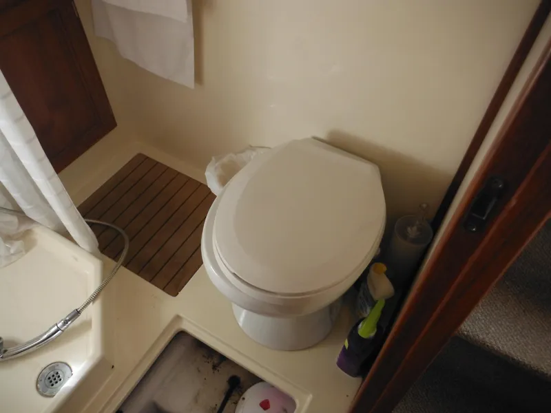 Slide: The Image of 2005 Nordic Tug 32 bathroom with toilet and shower area. - 38