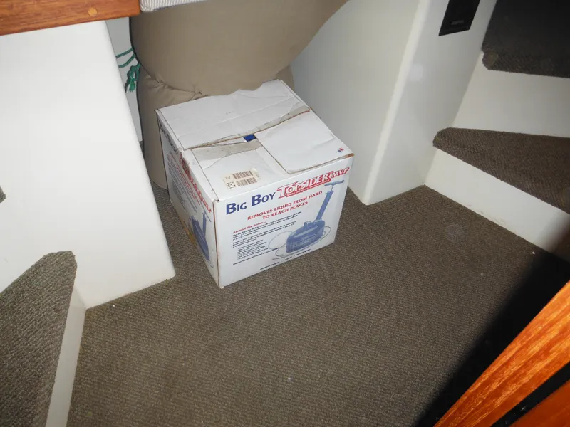 Slide: The Image of Box on carpeted floor inside 2005 Nordic Tug 32 boat interior. - 46