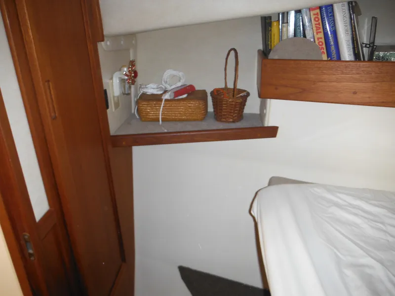 Slide: The Image of Cozy cabin interior of 2005 Nordic Tug 32 with shelves and storage baskets. - 47