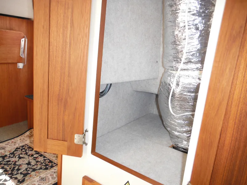 Slide: The Image of Interior of 2005 Nordic Tug 32 showing storage compartment with insulated ductwork. - 50