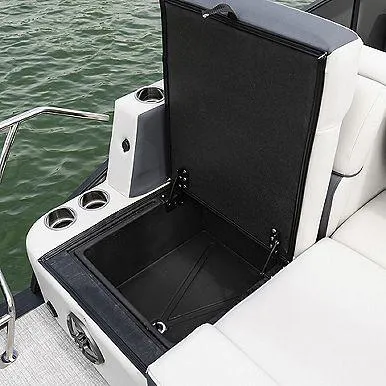 Slide: The Image of 2023 Harris 230 Sunliner boat with open storage compartment and cup holders. - 7