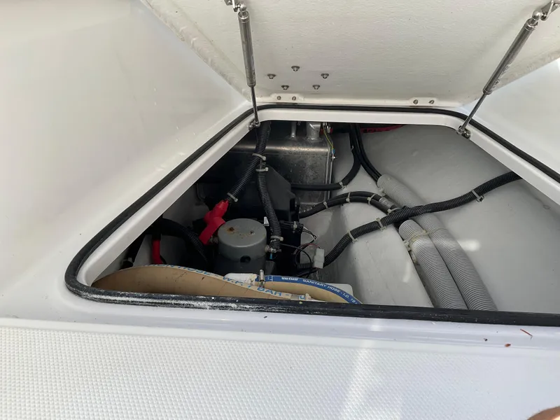 Slide: The Image of Engine compartment of 2020 Axopar 28 boat, showing wiring and components. - 13