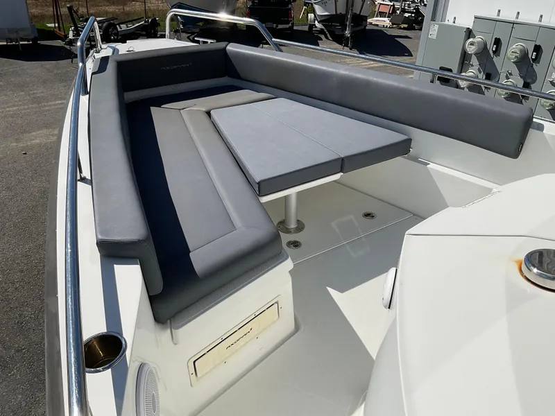 Slide: The Image of 2020 Axopar 28 boat with gray cushioned seating area. - 15