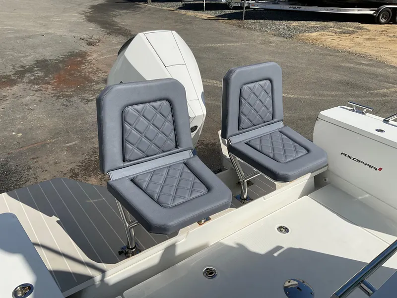 Slide: The Image of Axopar 28 boat seats, 2020 model, featuring gray quilted upholstery and sleek design. - 22