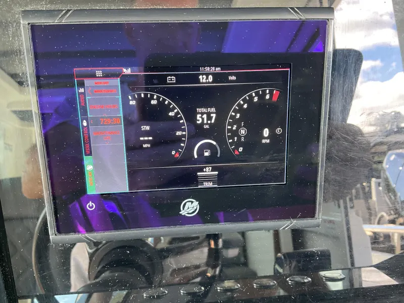 Slide: The Image of Digital dashboard display on 2020 Axopar 28 boat showing speed and fuel data. - 30