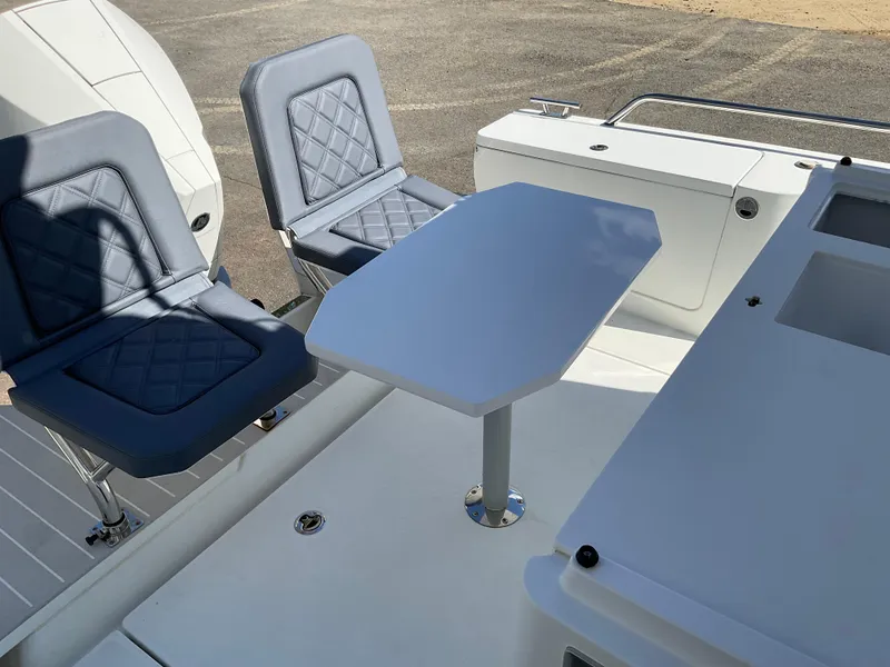 Slide: The Image of Axopar 28 boat interior with seating and table, 2020 model. - 8