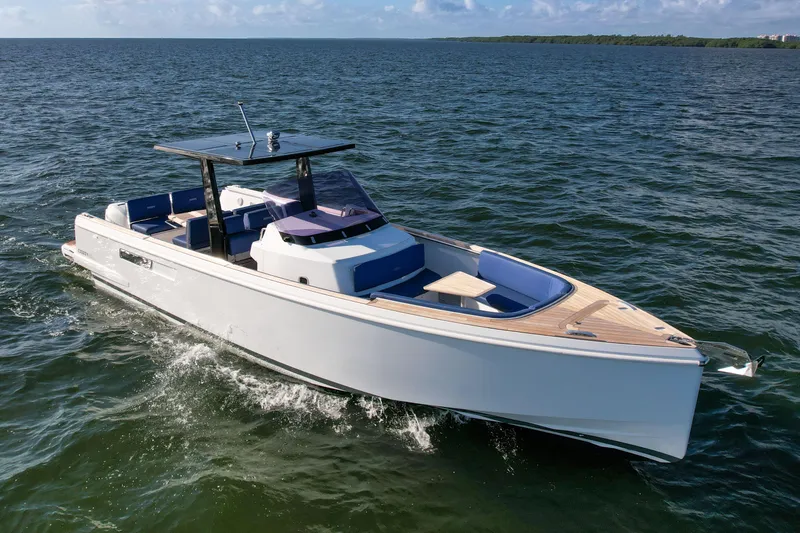 Slide: The Image of 2019 Fjord 38 Xpress cruising on open water under clear skies. - 0