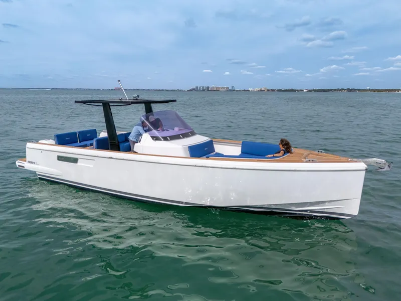 Slide: The Image of 2019 Fjord 38 Xpress boat cruising on open water with clear skies. - 16