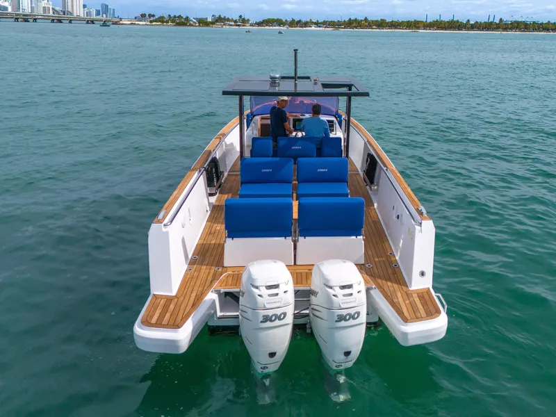 Slide: The Image of 2019 Fjord 38 Xpress boat with dual engines on open water. - 18