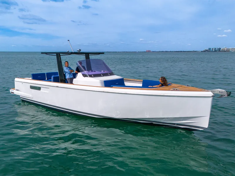 Slide: The Image of 2019 Fjord 38 Xpress boat cruising on open water under clear skies. - 22