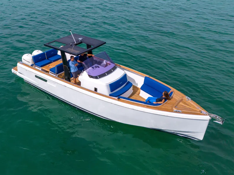 Slide: The Image of 2019 Fjord 38 Xpress boat cruising on clear blue water. - 23