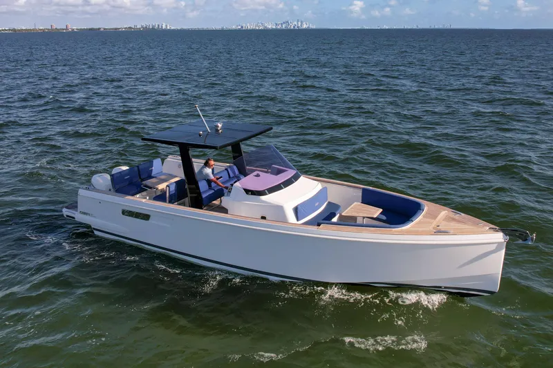 Slide: The Image of 2019 Fjord 38 Xpress cruising on open water under clear skies. - 3