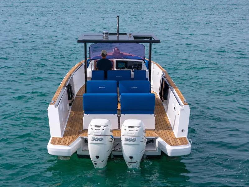 Slide: The Image of 2019 Fjord 38 Xpress boat with dual engines on open water. - 31