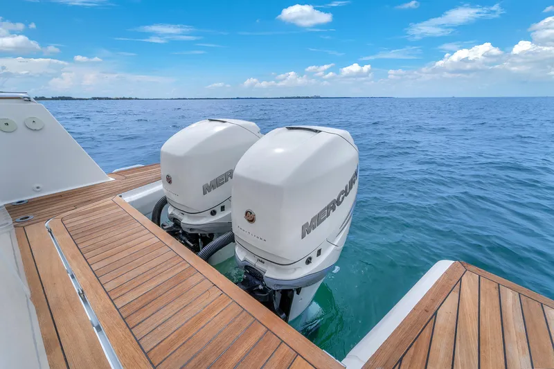 Slide: The Image of 2019 Fjord 38 Xpress boat with twin Mercury outboard engines on open sea. - 39