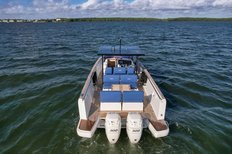 Slide: The Image of 2019 Fjord 38 Xpress boat on open water with twin engines. - 4