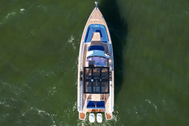 Slide: The Image of Aerial view of 2019 Fjord 38 Xpress yacht on green water. - 6