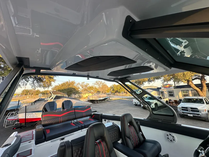 Slide: The Image of 2025 Monterey Elite 30 OB boat interior with sleek seating and modern design features. - 19
