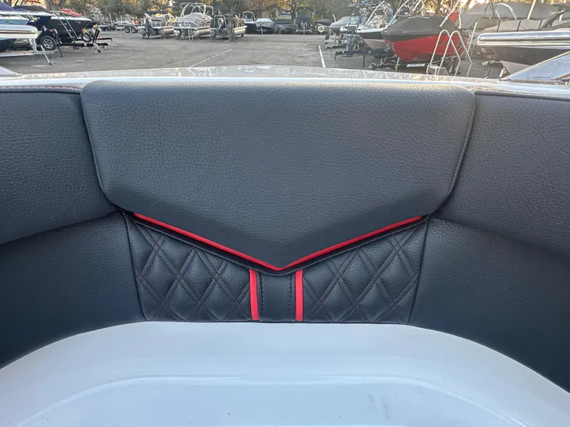 Slide: The Image of 2025 Monterey Elite 30 OB boat interior with black and red diamond-stitched upholstery. - 35