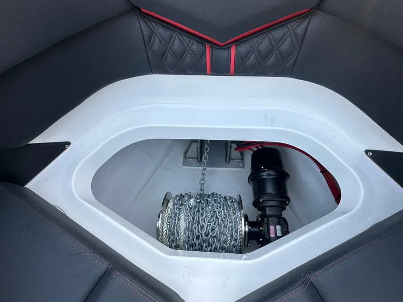 Slide: The Image of Anchor compartment of 2025 Monterey Elite 30 OB boat with chain and winch. - 36