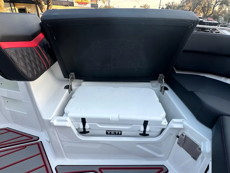Slide: The Image of 2025 Monterey Elite 30 OB boat with Yeti cooler storage compartment. - 39