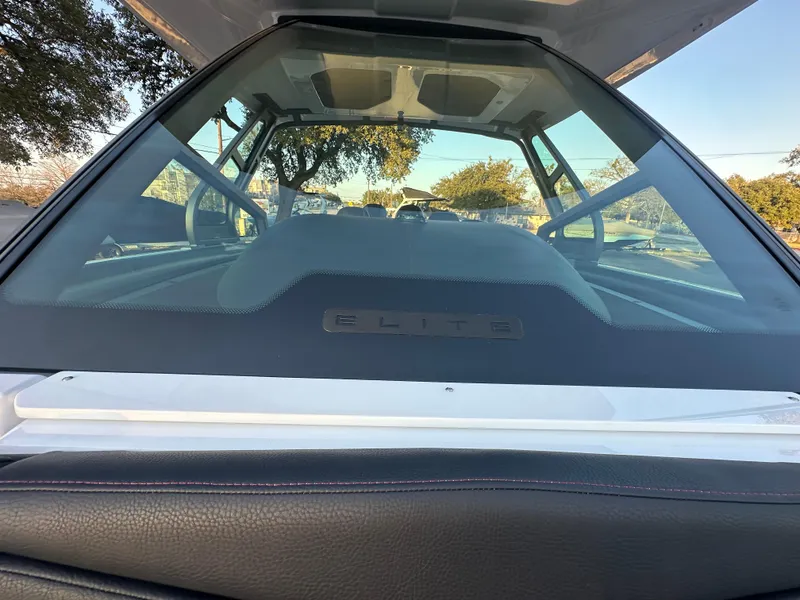 Slide: The Image of 2025 Monterey Elite 30 OB boat interior with windshield view and sleek design. - 41