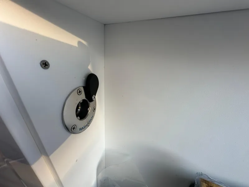 Slide: The Image of 2025 Monterey Elite 30 OB boat interior detail with a mounted accessory port. - 44