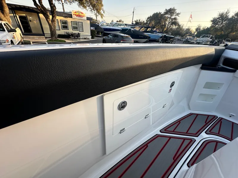 Slide: The Image of Interior view of 2025 Monterey Elite 30 OB boat, featuring sleek design and storage compartments. - 46