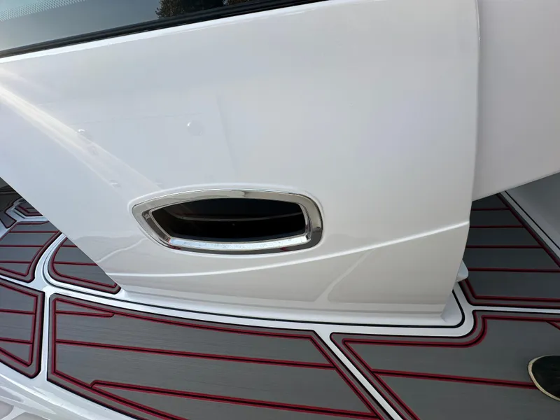 Slide: The Image of 2025 Monterey Elite 30 OB boat detail with sleek white exterior and stylish deck design. - 47