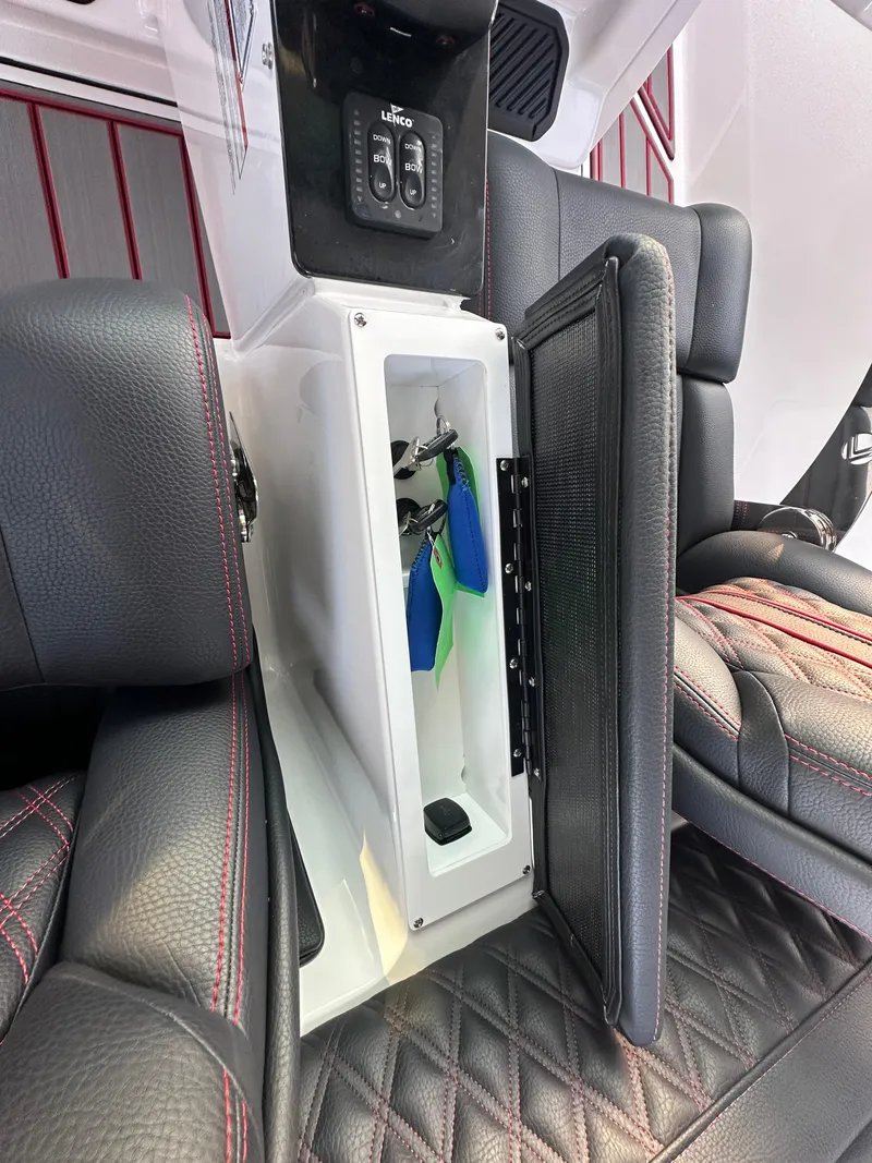 Slide: The Image of 2025 Monterey Elite 30 OB interior storage compartment with luxurious seating and modern design. - 49