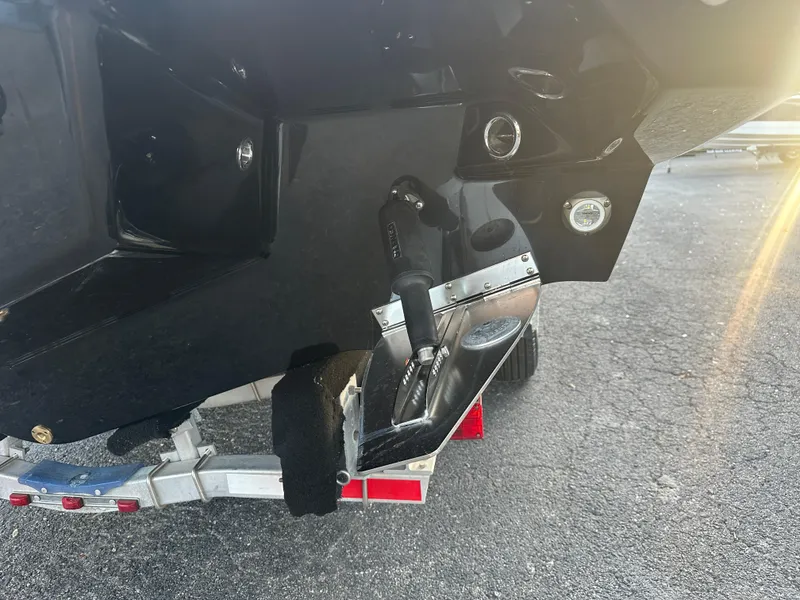 Slide: The Image of 2025 Monterey Elite 30 OB boat trailer hitch and rear detail in sunlight. - 87