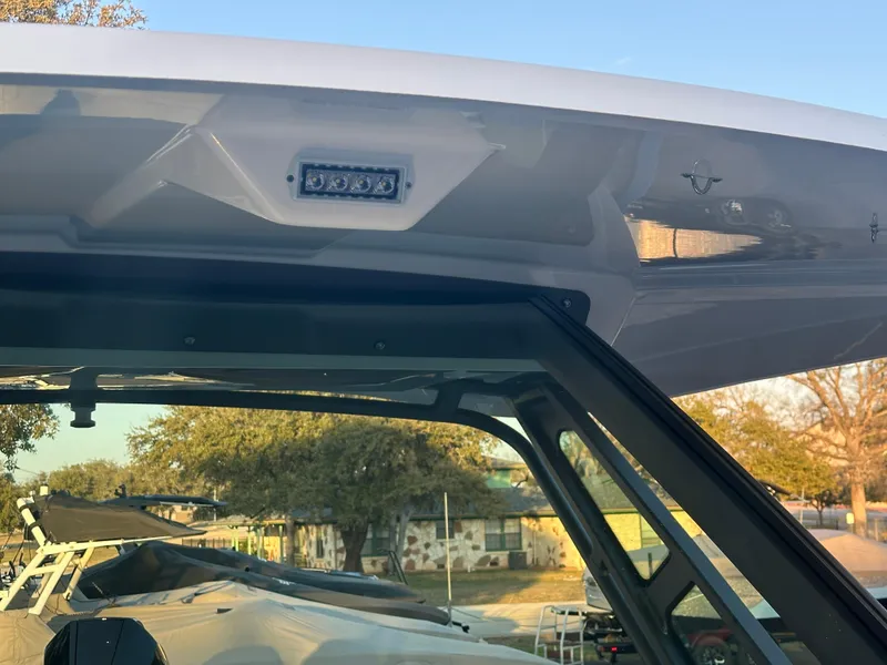 Slide: The Image of 2025 Monterey Elite 30 OB boat roof detail with LED light, showcasing sleek design. - 89