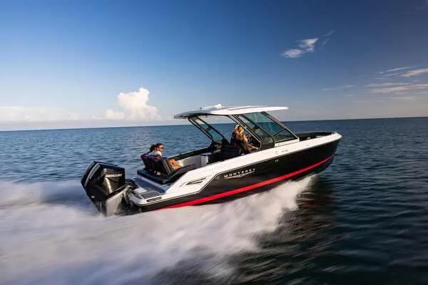 Slide: The Image of 2025 Monterey Elite 30 OB speedboat cruising on open water. - 9