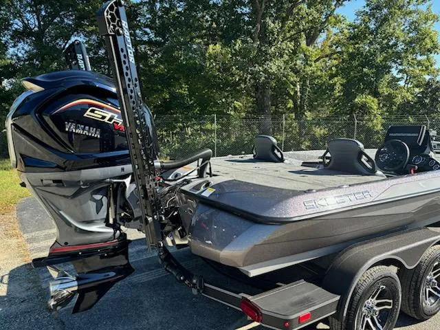 Slide: The Image of 2025 Skeeter ZXR 21 boat with Yamaha engine, parked outdoors on a sunny day. - 3