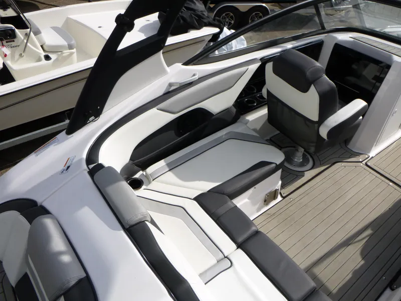 Slide: The Image of 2021 Yamaha Boats 212S interior with sleek seating and modern design. - 13